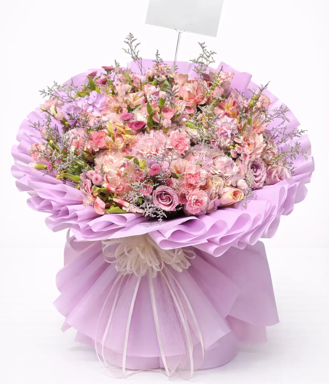 Bouquet floral en tonos pastel con diseño elegante y presentación premium. Arreglo de flores frescas
